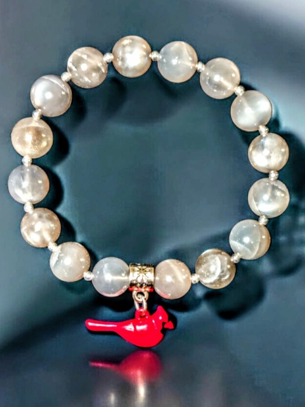 Elegant Gray Bead Stretch Bracelet with Red Bird Charm